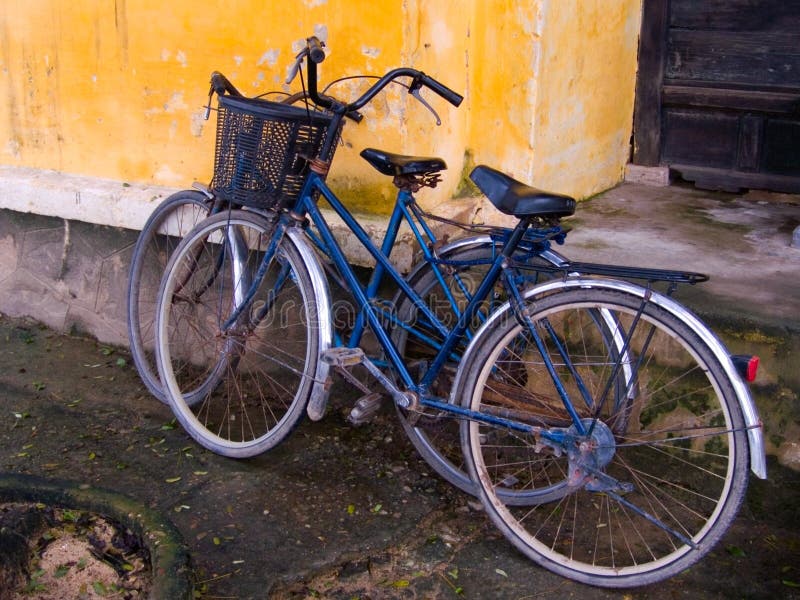 Old Bicycles against Crumbling Building in Hoi An, Vietnam. Old Bicycles against Crumbling Building in Hoi An, Vietnam