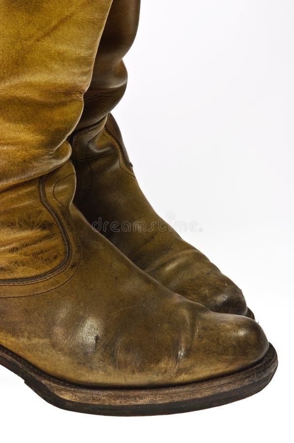 Old worn cowboy style boots from the seventies of the twentieth century - isolated. Old worn cowboy style boots from the seventies of the twentieth century - isolated