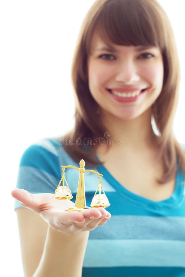 Old scales in a hand on a white background. Old scales in a hand on a white background