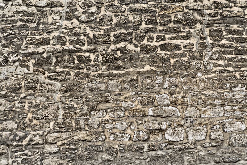 Alte verwitterte Backsteinmauer stockbilder