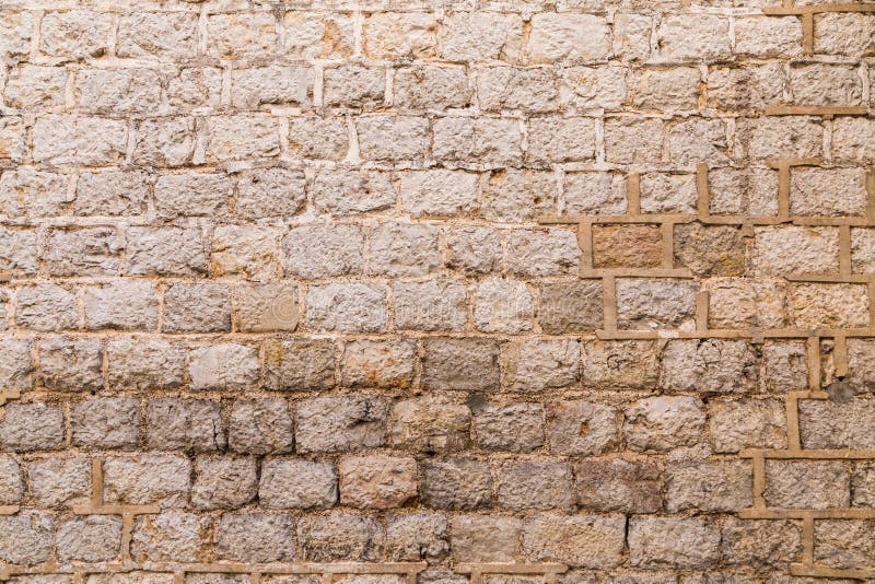 Alte verwitterte Backsteinmauer stockbilder