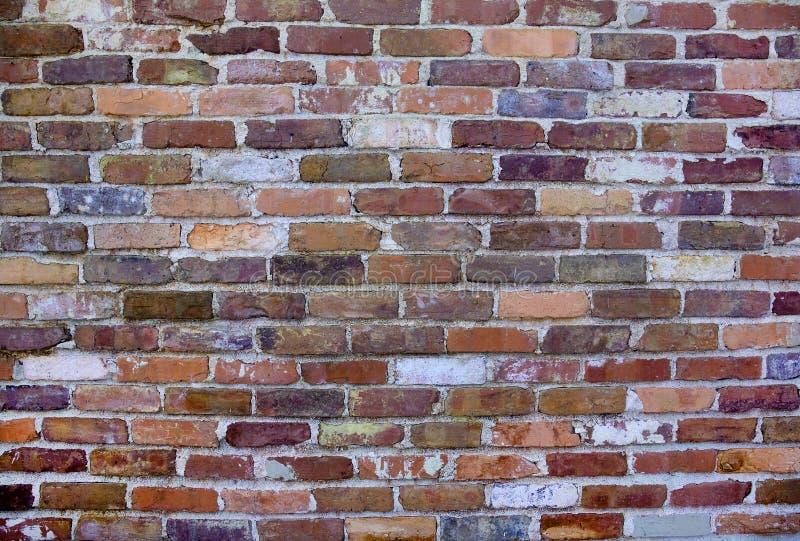 Alte, verwitterte Backsteinmauer lizenzfreie stockbilder