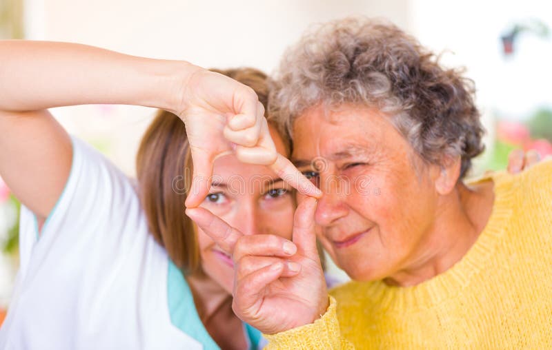 Happy elderly women enjoy the time with her daughter. Happy elderly women enjoy the time with her daughter