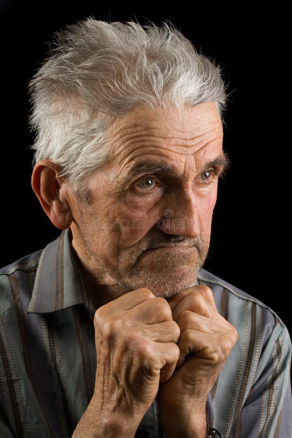 Portrait of an old man isolated on black. Portrait of an old man isolated on black