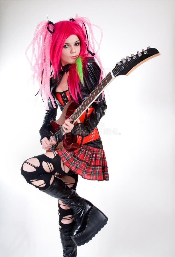 Alternative fashion girl playing guitar
