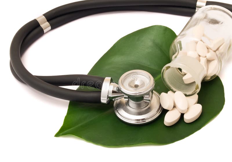 Pills, bottle and stethoscope on the leaf. Green herbal drug medicine stock images, royalty-free photos and pictures