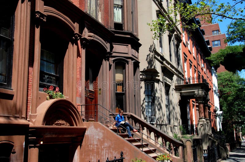 Handsome 19th century brownstones, many with high stoops, line the west side of Henry Street in the Brooklyn Heights, New York historic district. Handsome 19th century brownstones, many with high stoops, line the west side of Henry Street in the Brooklyn Heights, New York historic district.