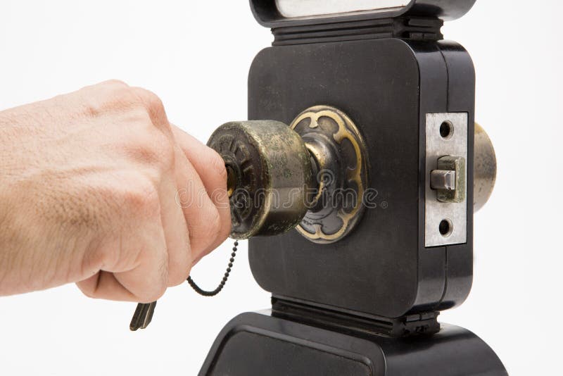 Aluminium Door Knob on the Black Door White Background. Stock Photo