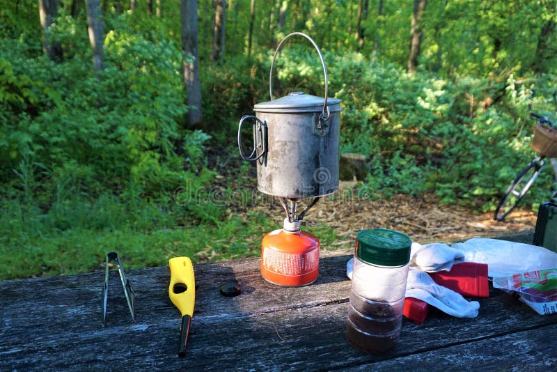 Cooking pot on fuel canister in camp