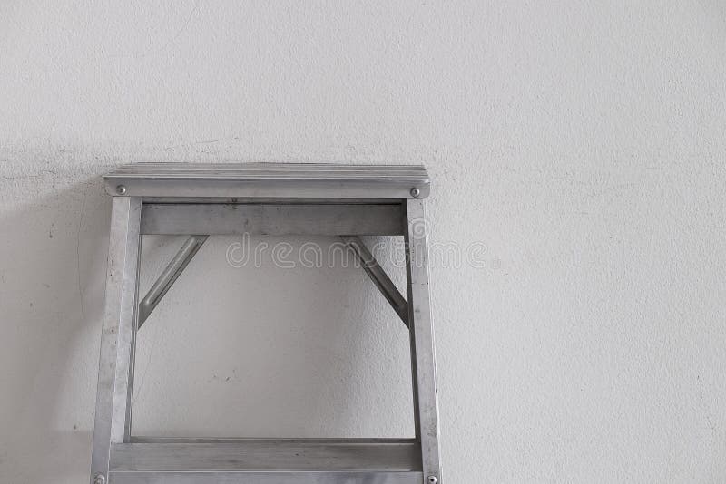 Aluminum ladder on the wall.