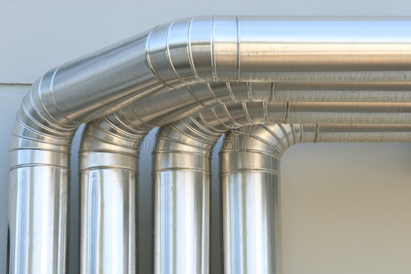 Aluminum ventilation air Pipes on wall building.