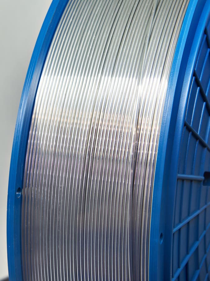 Aluminum Wire In The Bay On The Background Of Grass, Trimmed With A