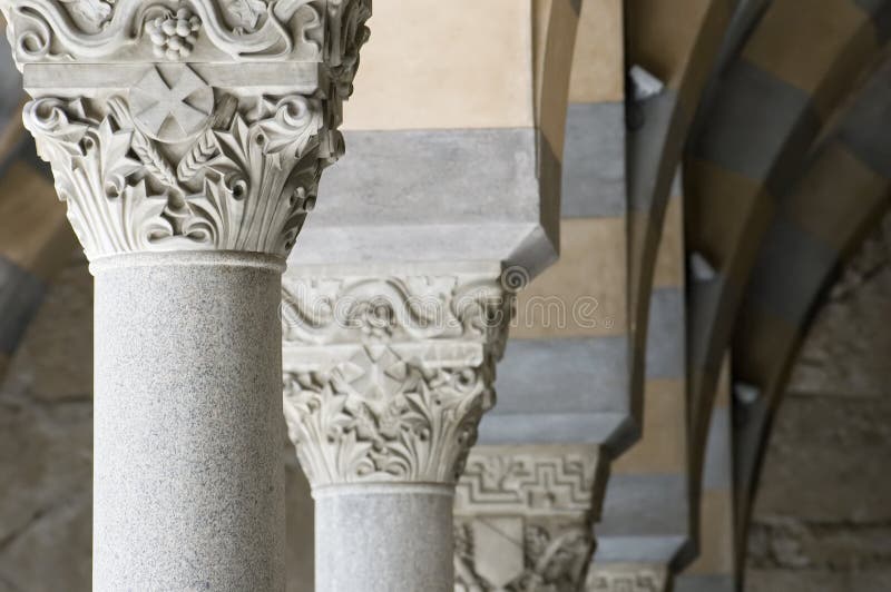 Detail of Saint Andrews cathedral in Amalfi, Italy, covered with Byzantine mosaics and polychrome faiences. Columns and capitol rows. Detail of Saint Andrews cathedral in Amalfi, Italy, covered with Byzantine mosaics and polychrome faiences. Columns and capitol rows.