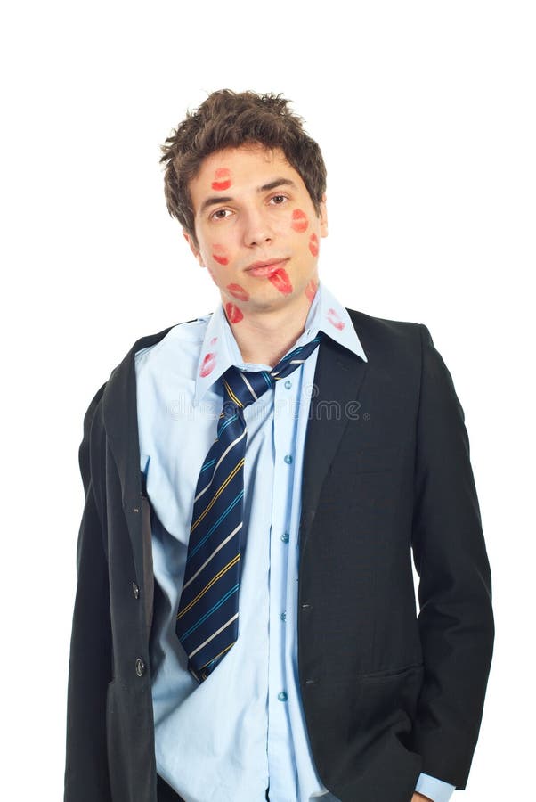 Business man being ravaged by so many kisses received isolated on white background. Business man being ravaged by so many kisses received isolated on white background