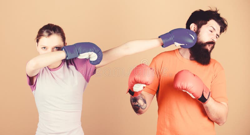 Amateur boxing club. Strength and power. Family violence. Man and woman in boxing gloves. Boxing sport concept. Couple stock photography Amateur boxing club. Strength and power. Family violence. Man and woman in boxing gloves. Boxing sport concept. Couple stock photography