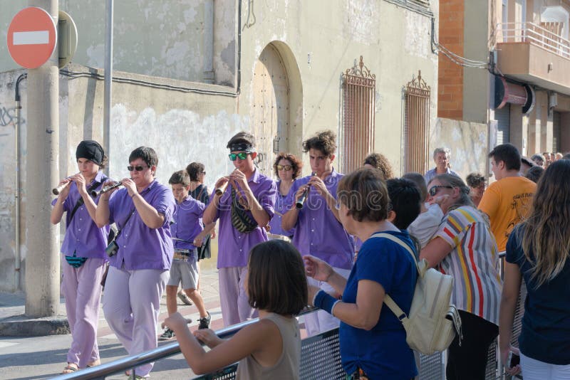 Malgrat de Mar, Spain, August 2018. Amateur orchestra of the district marches ahead of the figures of fairy-tale heroes. Amateur orchestra of the district stock photos Malgrat de Mar, Spain, August 2018. Amateur orchestra of the district marches ahead of the figures of fairy-tale heroes. Amateur orchestra of the district stock photos