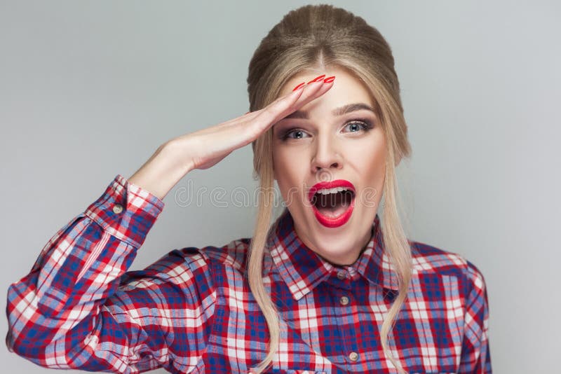 Amazed beautiful blonde girl in pink checkered shirt, collected royalty free stock photos Amazed beautiful blonde girl in pink checkered shirt, collected royalty free stock photos