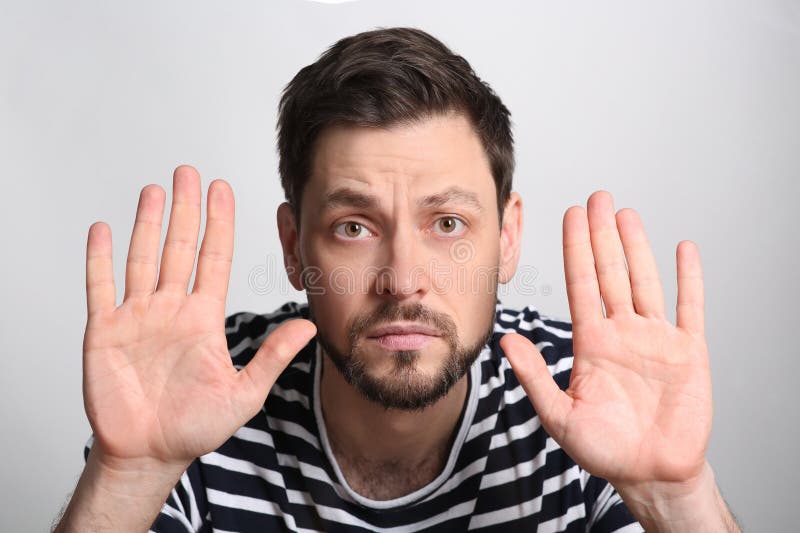 Amazed handsome man stuck to transparent screen. Internet addiction royalty free stock images