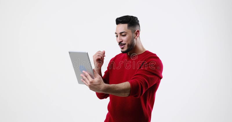 Amazed young man using digital tablet stock footage