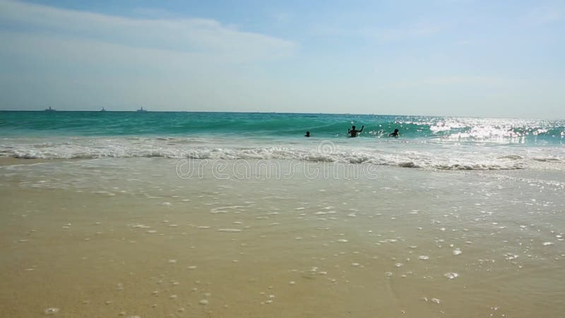 Amazing beauty  white foamy waves and turquoise water on Eagle Beach of Aruba Island. Caribbean.