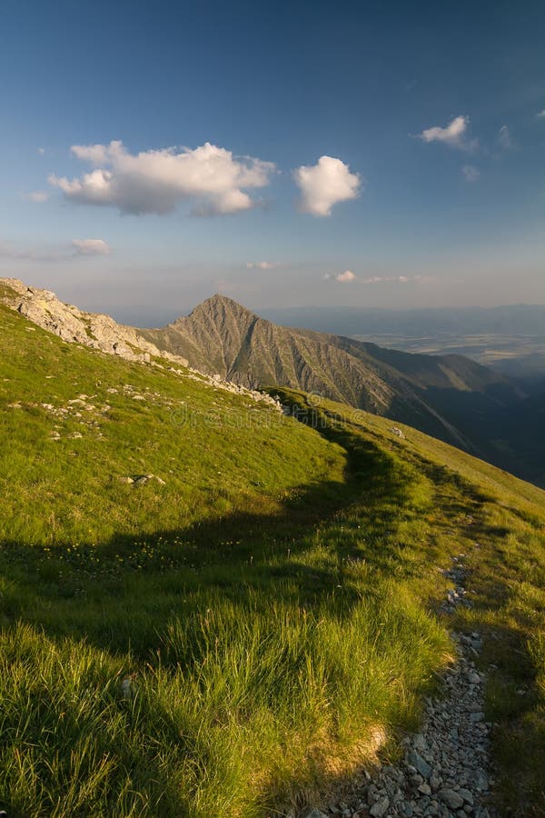 Amazing evening on ridge of the summer mountains