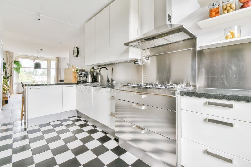 Amazing Kitchen with Black and White Checkerboard Floor Stock Photo