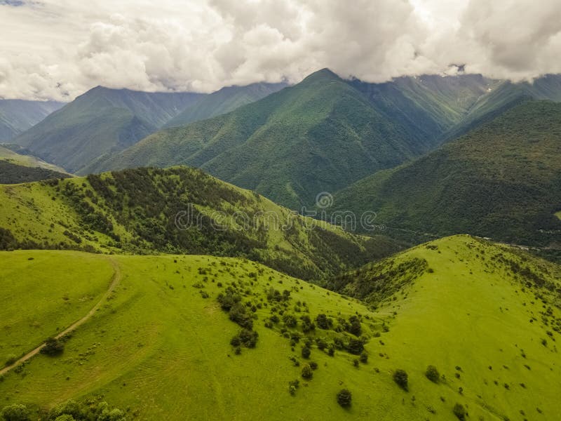 Amazing mountain landscape. Beautiful clouds, fields, mountains.