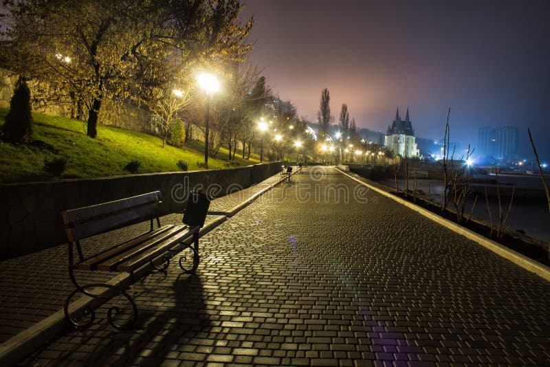 Amazing night park street view with castle on background