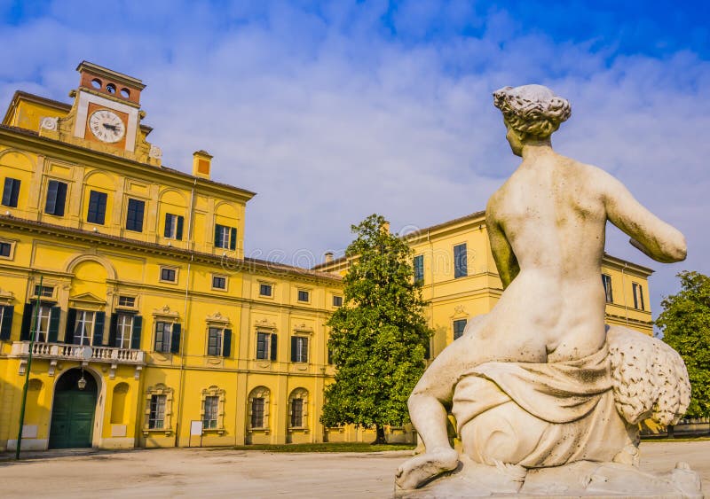 Ducal garden`s palace with marble statue in foreground, Parma, Italy