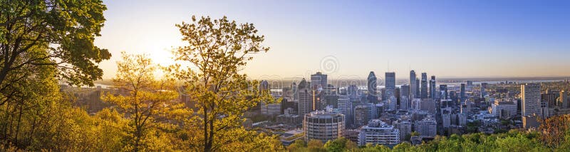 Amazing view of Montreal city at sunrise with colorful blue architecture, green and yellow landscape. Beautiful sky and sun light royalty free stock photos Amazing view of Montreal city at sunrise with colorful blue architecture, green and yellow landscape. Beautiful sky and sun light royalty free stock photos