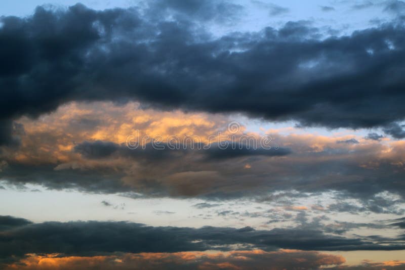 Amazing colorful sun colored partially cloudy sky for using in design as background stock images