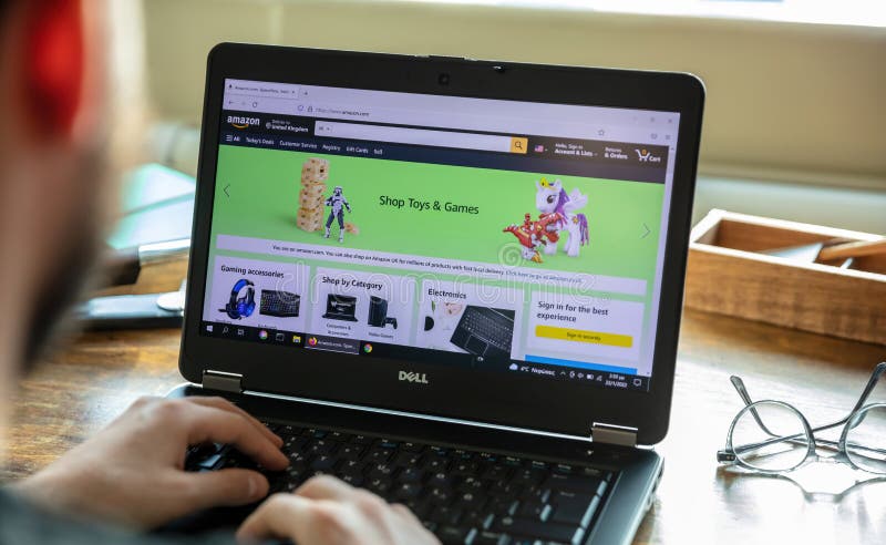 Amazon com app shop toys and games amazon uk pc on blur office desk hand on keyboard 
