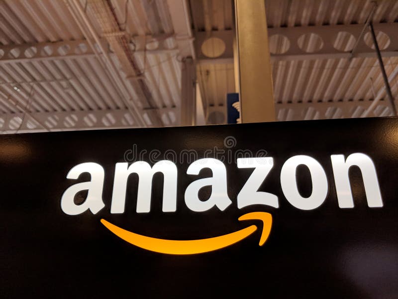 Amazon logo on black shiny wall in Honolulu Best Buy store