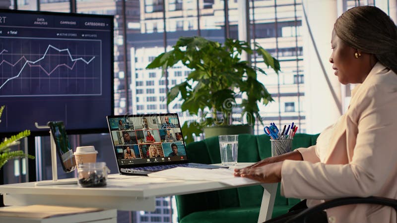 Ambitious black businesswoman negotiating with investors on online videoconference royalty free stock photos