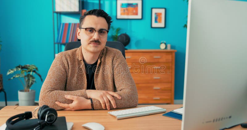 Ambitious, meticulous employee of an accounting office, sitting in front of a computer, elegantly dressed stock video footage