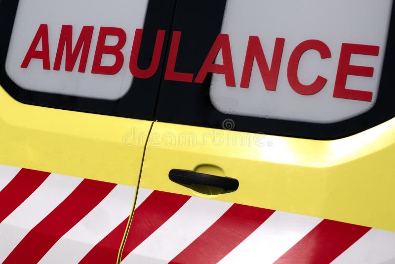 Ambulance. Red inscription on a yellow car. Emergency. Concept for design on the theme of health and helping sick people. Close-up royalty free stock photography Ambulance. Red inscription on a yellow car. Emergency. Concept for design on the theme of health and helping sick people. Close-up royalty free stock photography