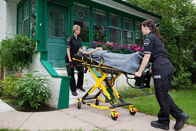 Ambulance Workers with Senior Woman stock photos