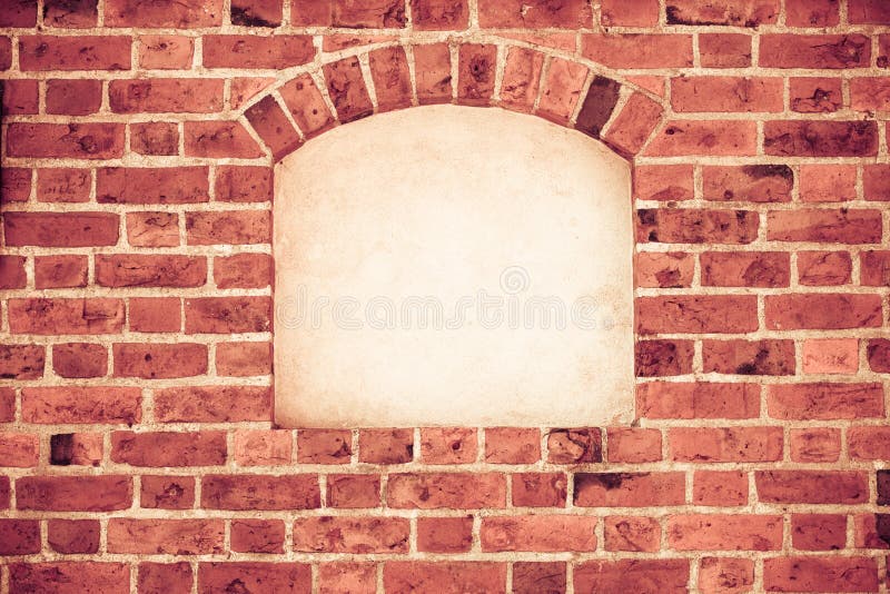 Old stone arch arc niche with space for text frame in brick wall background. Old stone arch arc niche with space for text frame in brick wall background