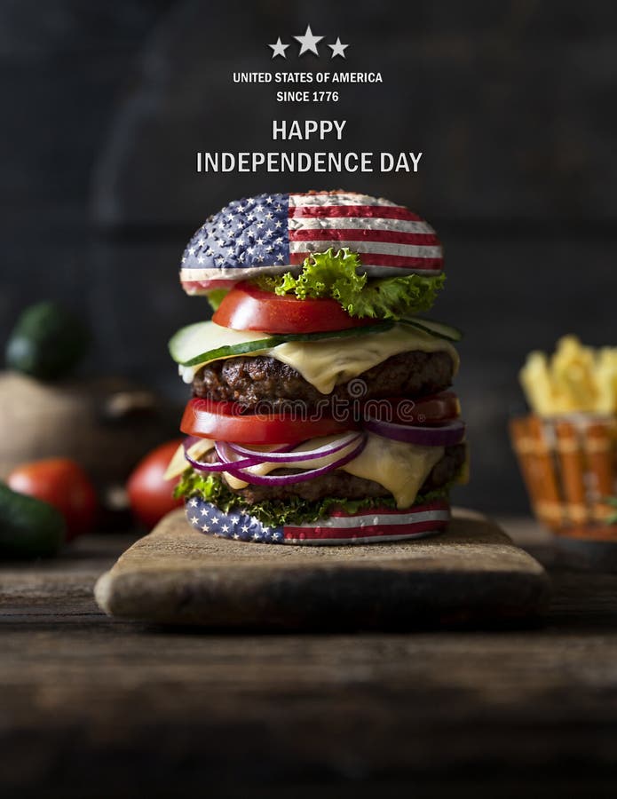 American Burger with tomatoes, onions, cucumber, lettuce and melting cheese. United States of America flag. Happy independence day