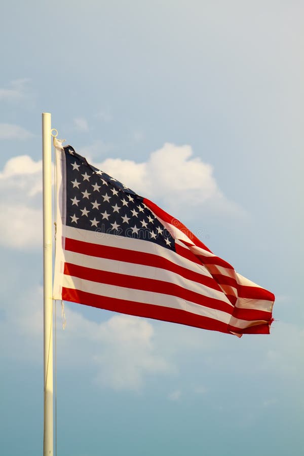 American Flag on a Blue Sky with Clouds Background Stock Image Image