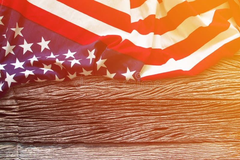 American flag border on wooden background