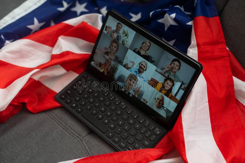 American flag and digital tablet on table