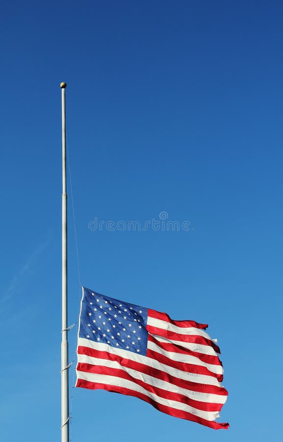 American flag flying at half staff in memory of Newtown massacre victims . stock photo American flag flying at half staff in memory of Newtown massacre victims . stock photo