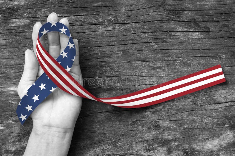American flag pattern awareness ribbon color splashed on human hand grunge background: United states of america public holiday USA royalty free stock photo American flag pattern awareness ribbon color splashed on human hand grunge background: United states of america public holiday USA royalty free stock photo