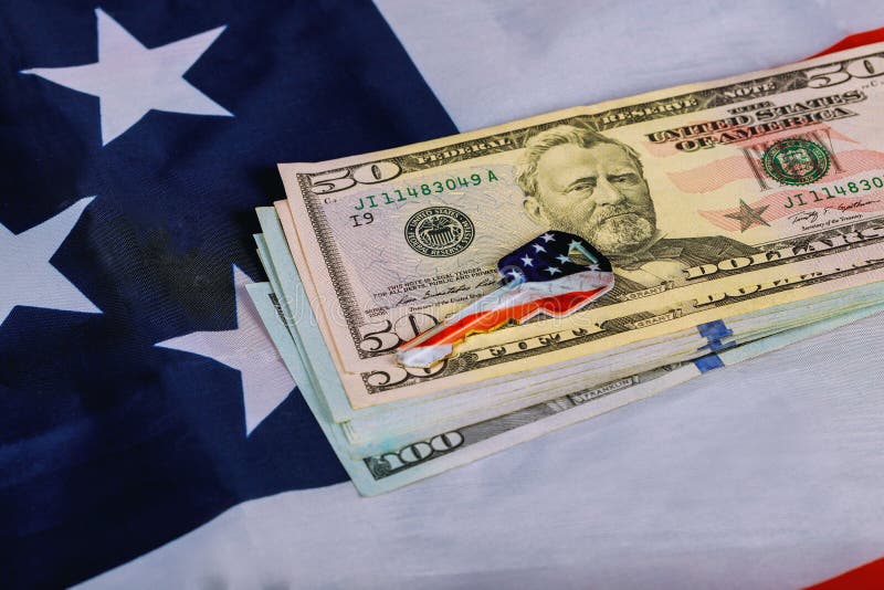 American flag and US dollars and a house key on the apartment architectural plan. Sale and purchase real estate, buying home conce stock images American flag and US dollars and a house key on the apartment architectural plan. Sale and purchase real estate, buying home conce stock images