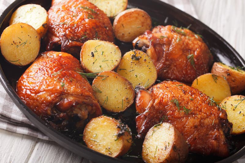 American Food: maple chicken thighs and baby potatoes close-up.