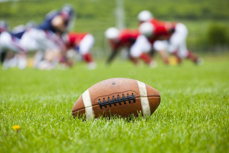American football ball on the field royalty free stock photos American football ball on the field royalty free stock photos