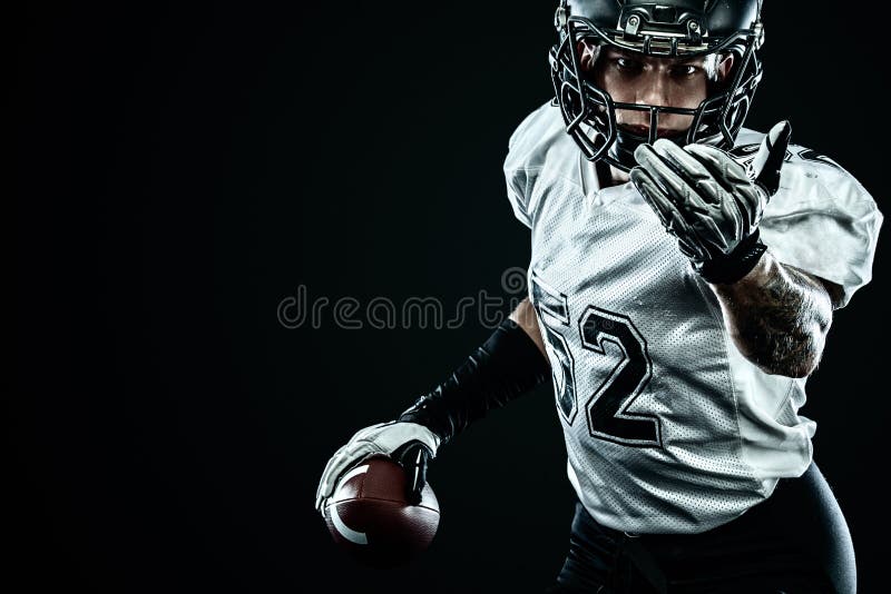 American Football Sportsman Player in Helmet Isolated on Black Background.  Sport and Motivation Wallpaper. Stock Photo - Image of player, creative:  155404828