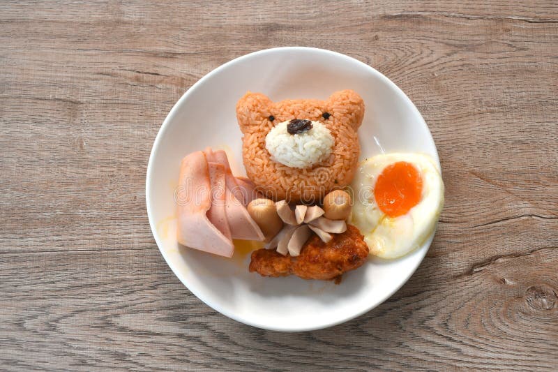 American fried rice Thai applied food decorating cute bear on white plate