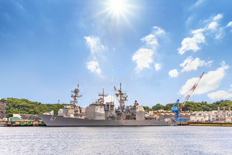 Yokosuka, japan - july 19 2020: Wide angle view of the American USS Shiloh CG-67, a Ticonderoga-class guided missile cruiser of United States Navy berthed in the Japanese Yokosuka naval base. Yokosuka, japan - july 19 2020: Wide angle view of the American USS Shiloh CG-67, a Ticonderoga-class guided missile cruiser of United States Navy berthed in the Japanese Yokosuka naval base.